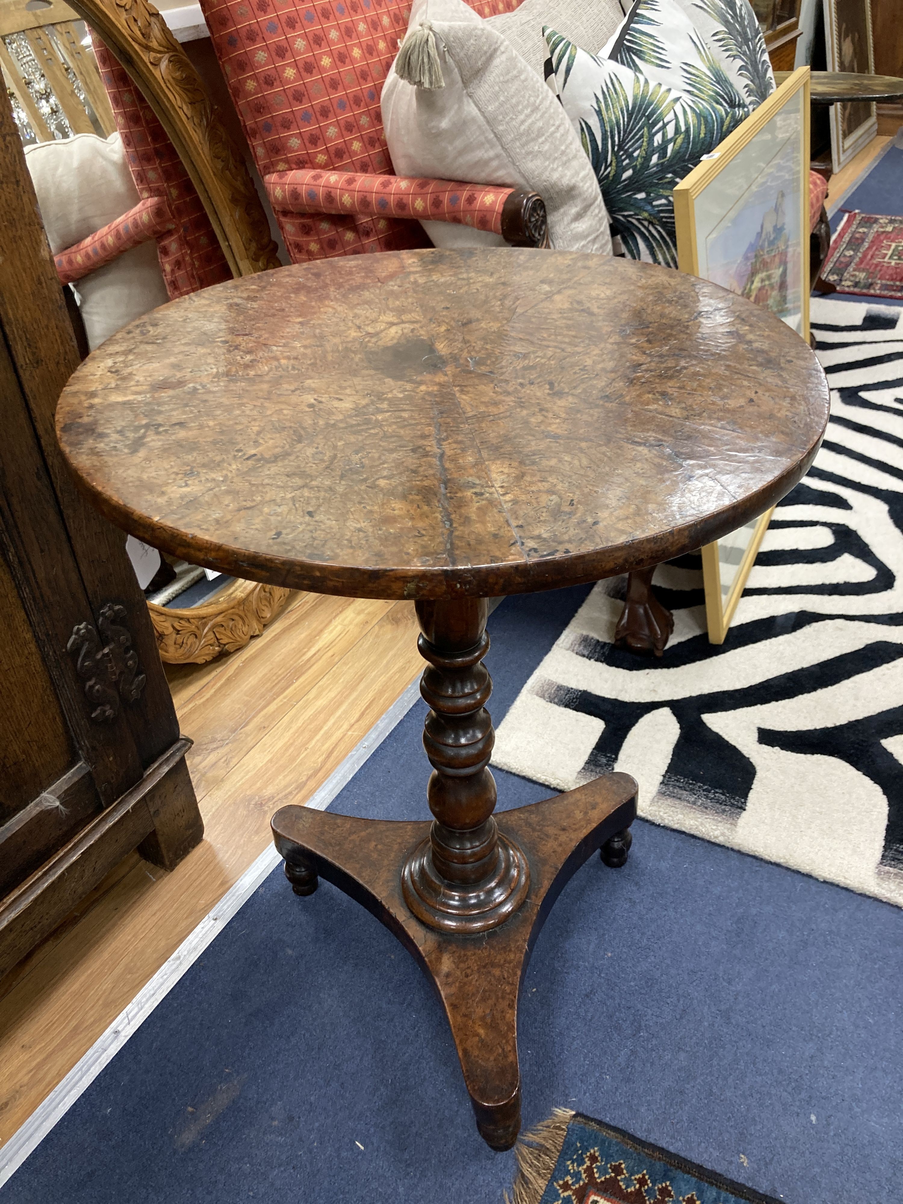 A George III yew and burr yew circular tea table. D-56, H-73cm.